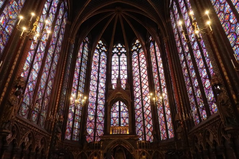 Dark sainte anne cathedral with painted glass in Paris