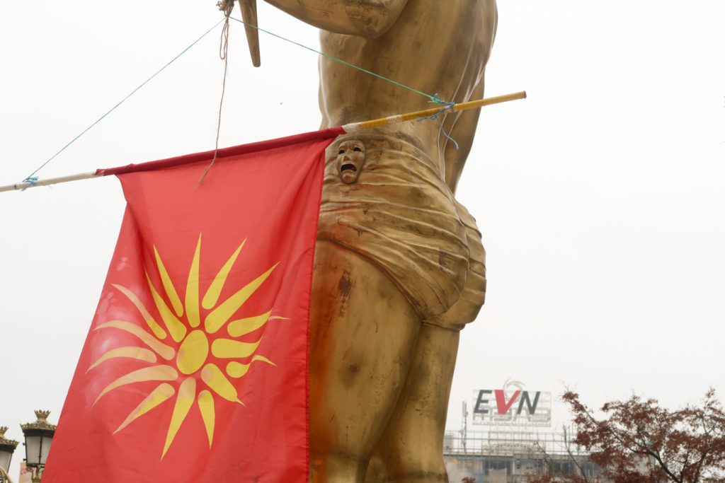 golden statue with macedonian flag